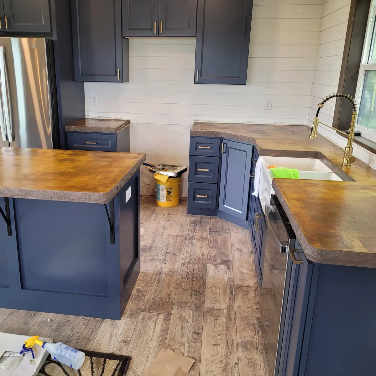 Concrete Countertop with stone edge and brown acid stained countertop