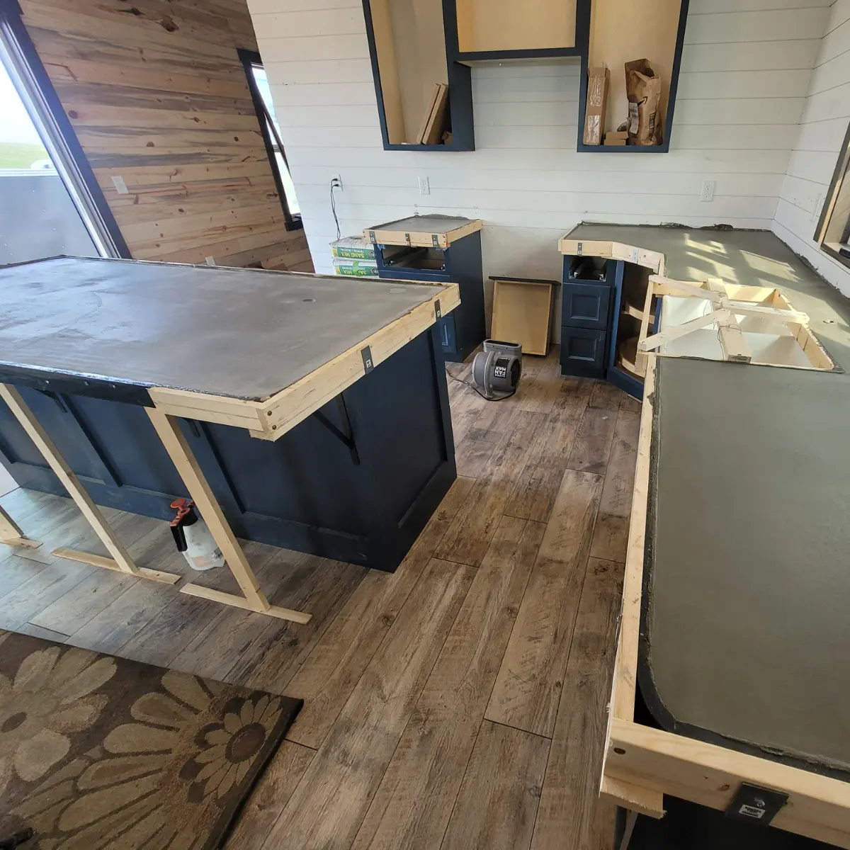 Concrete Countertop poured with forms still on with stone edge and kwik top brackets for forming