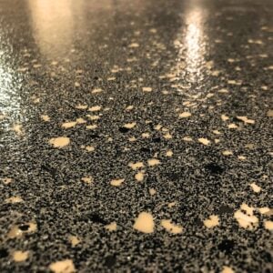 Quartz flooring with polyaspartic concrete coating