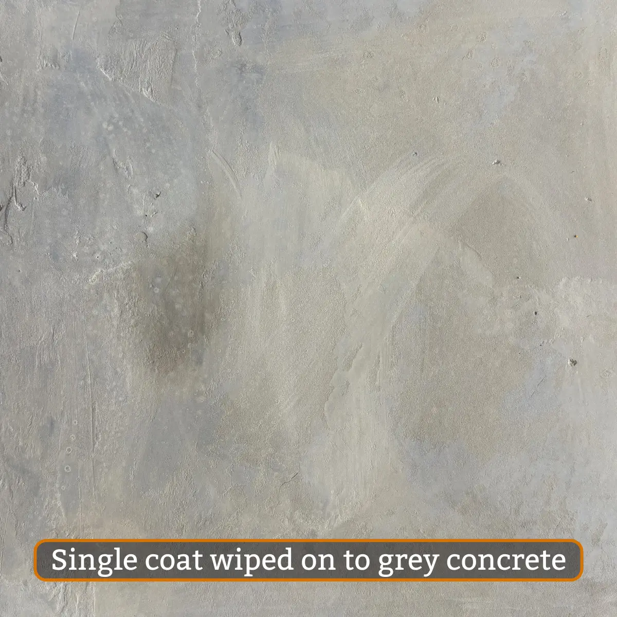 Champagne water-based concrete stain single layer on grey concrete
